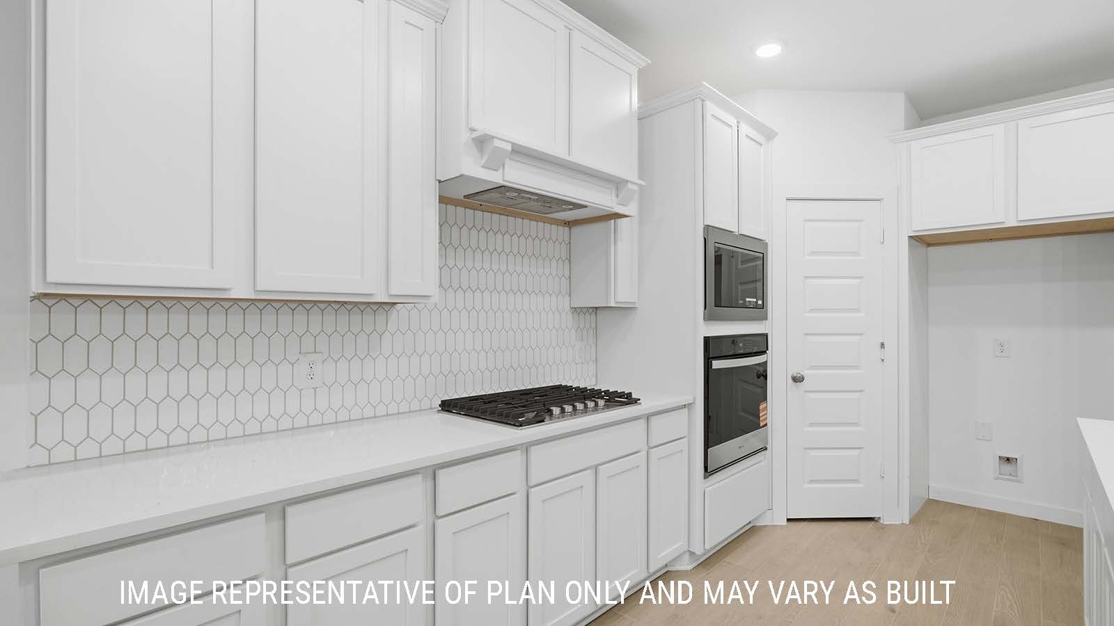 Berkshire kitchen with white cabinets and white countertops with fridge connection.