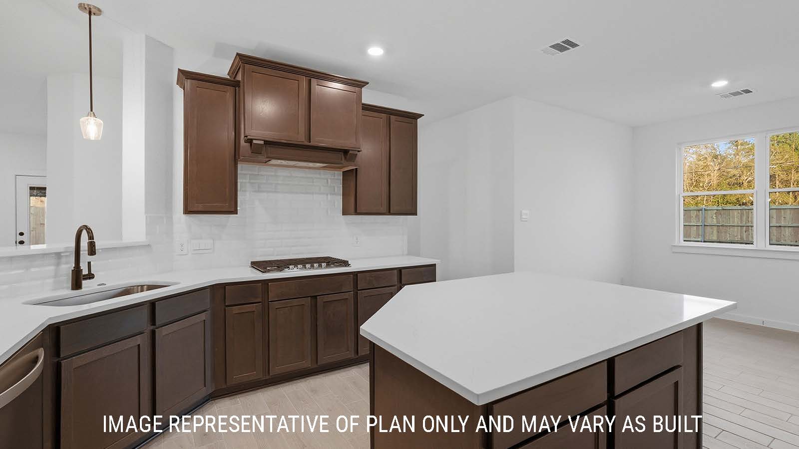 Newburgh kitchen with dark cabinets and white countertops and view of living room.