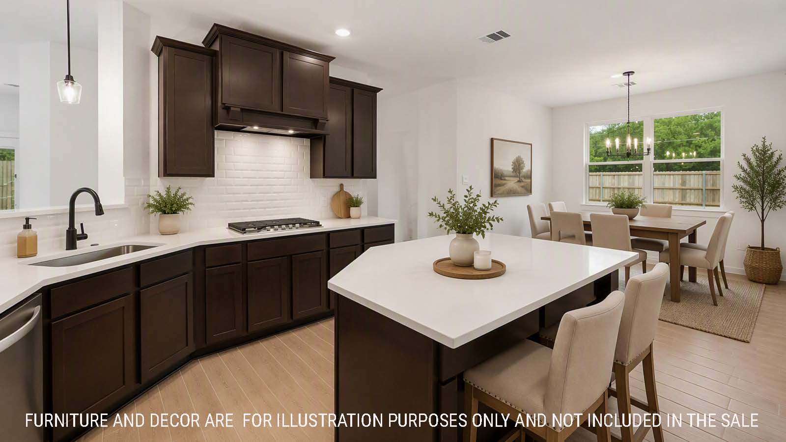 Newburgh kitchen with dark cabinets and white countertops and view of dining room.