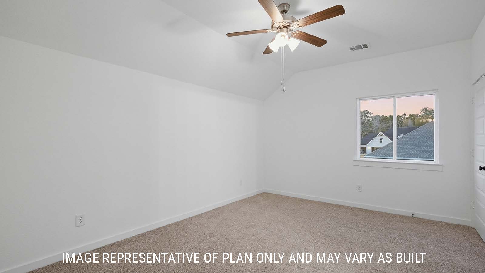 Newburgh secondary bedroom with carpeted flooring and windows for natural lighting.