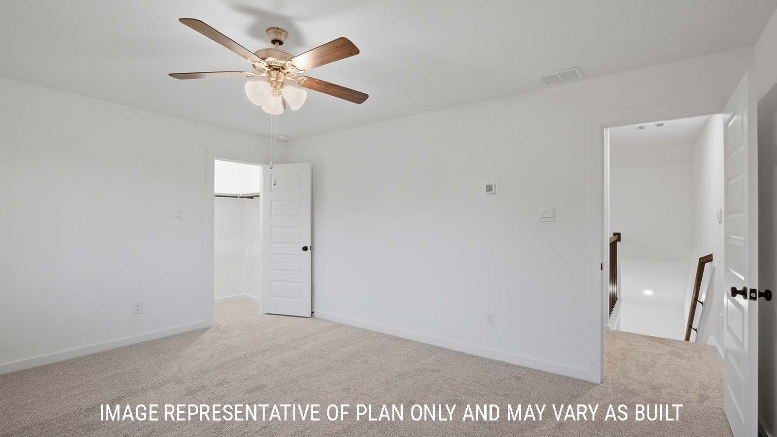 Newburgh secondary bedroom with carpeted flooring and view of game room and stairs.