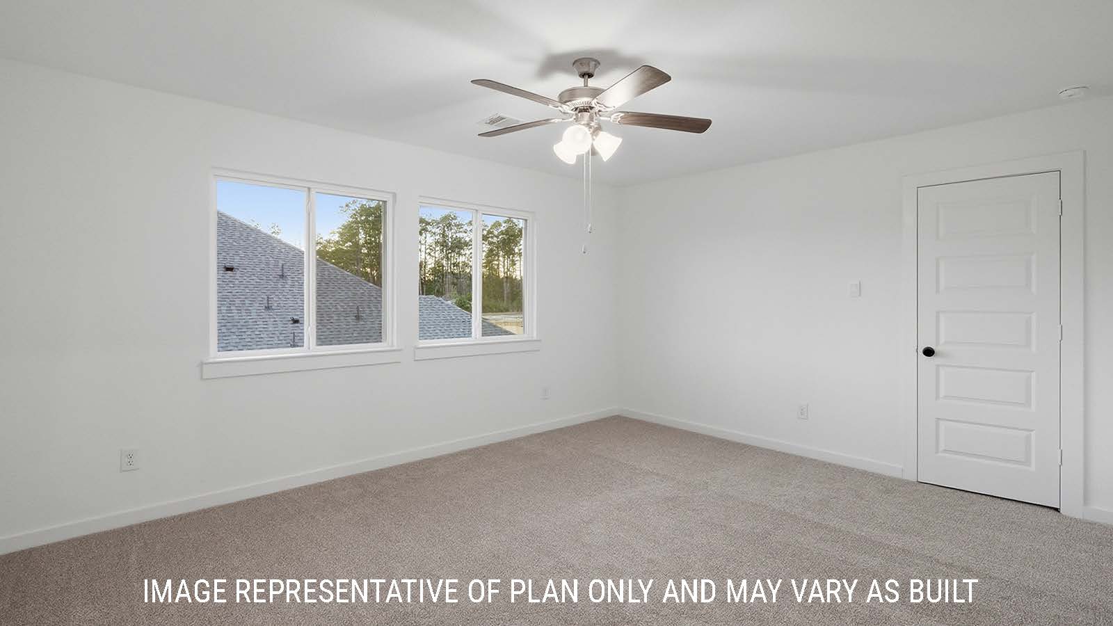 Newburgh secondary bedroom with carpeted flooring and windows for natural lighting.
