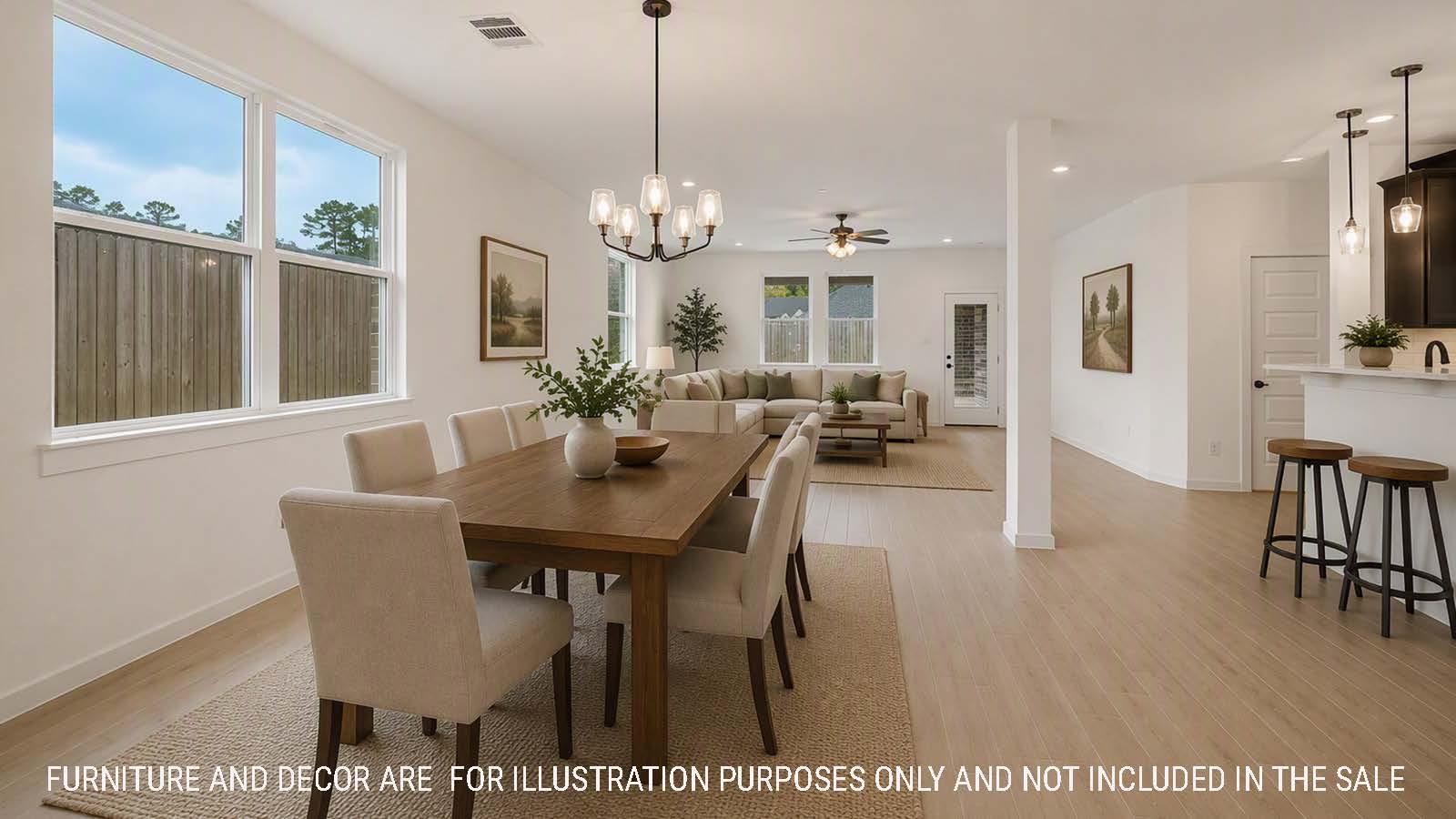 Newburgh dining room with view of kitchen and living room with windows for natural lighting.