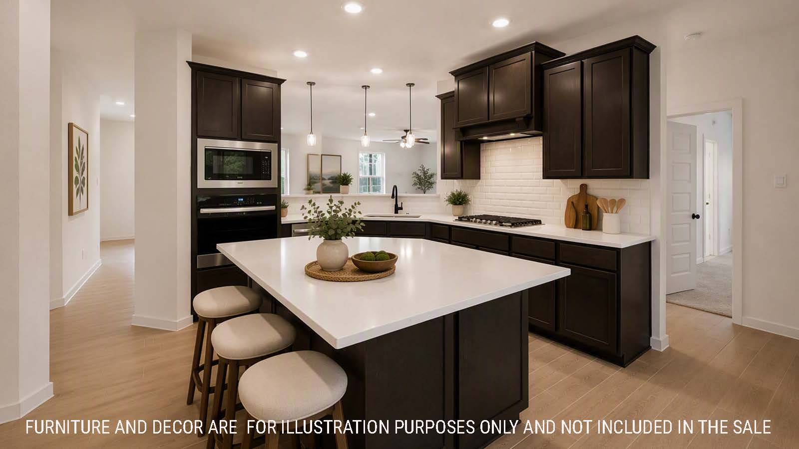 Newburgh kitchen with dark cabinets and white countertops and view of living room.