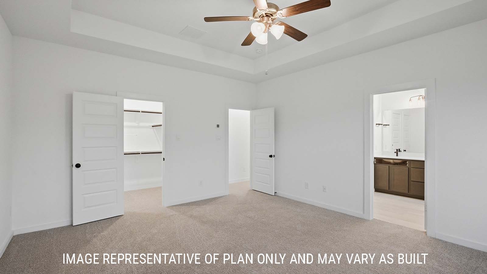 Newburgh primary bedroom with carpeted flooring and view of primary bathroom.