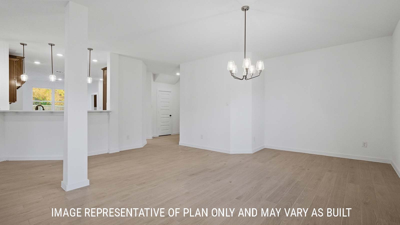 Newburgh dining room with vinyl plank flooring and view of front entry hallway and kitchen.