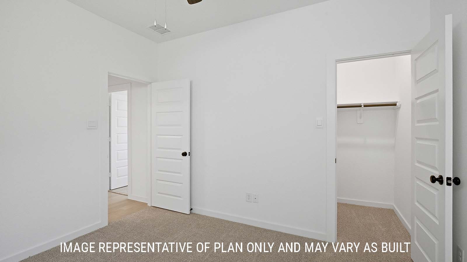 Newburgh secondary bedroom with carpeted flooring and view of closet and hallway.