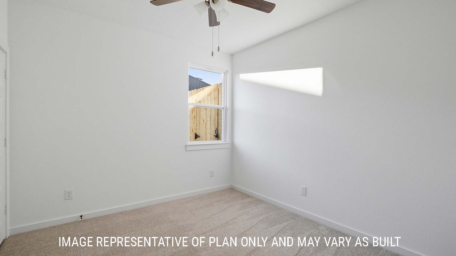 Newburgh secondary bedroom with carpeted flooring and window for natural lighting.