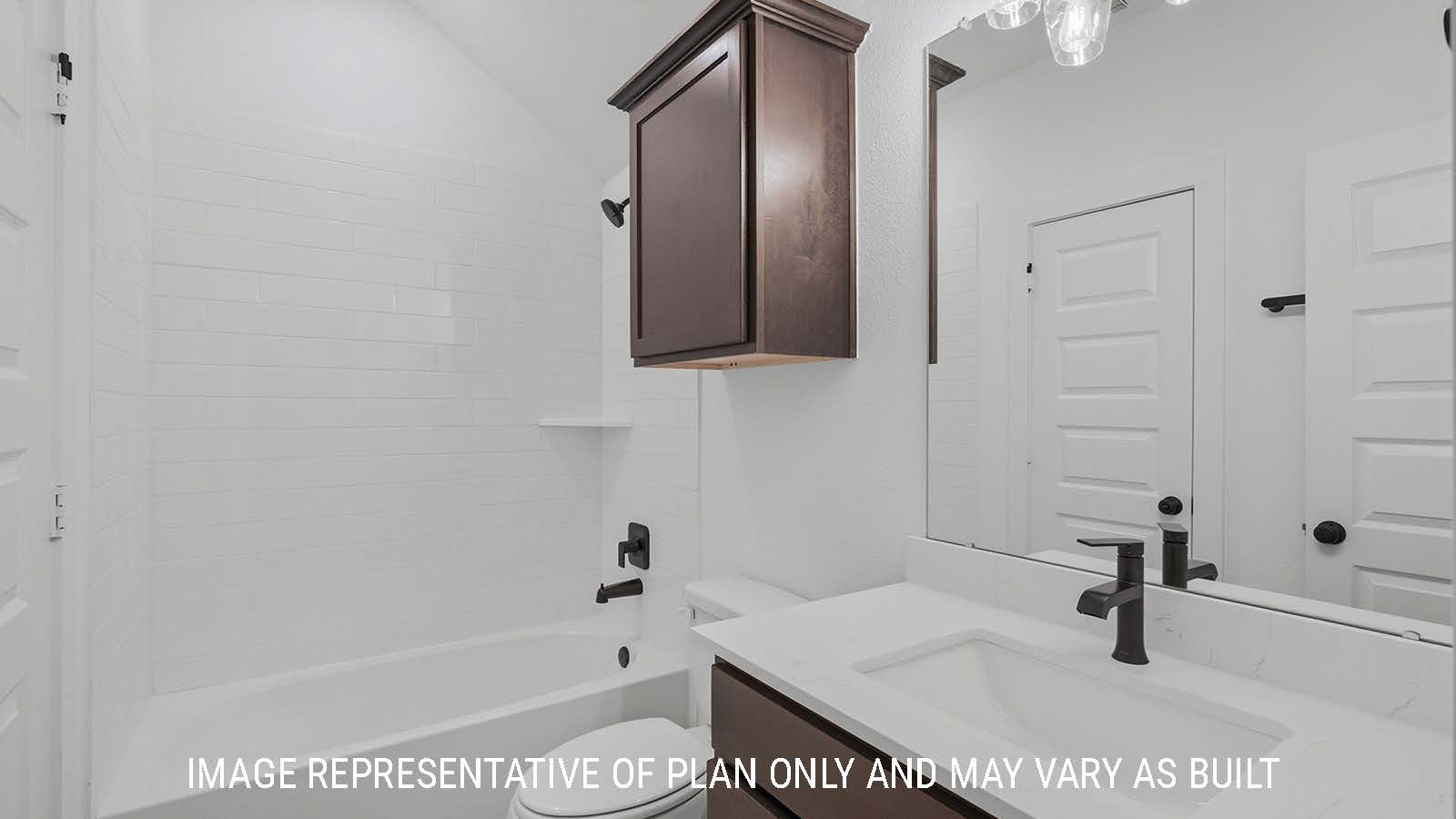 Newburgh secondary bathroom with vanity sink with white countertops and shower and tub combo.