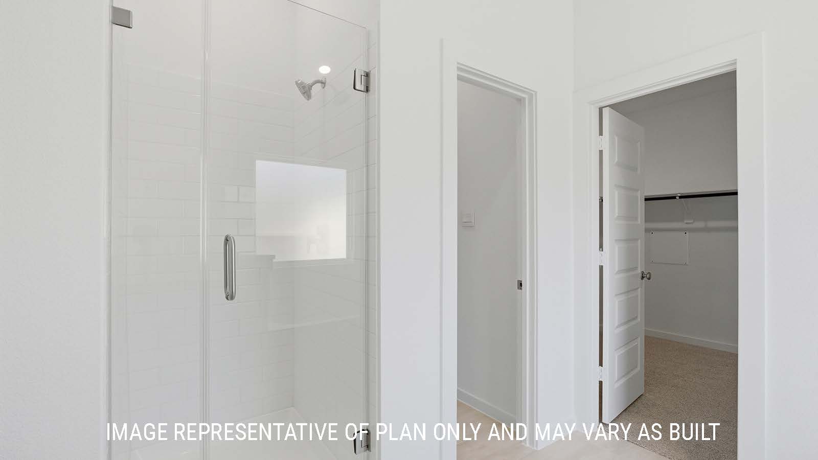 Waverley primary bathroom with walk-in shower and primary walk-in closet.