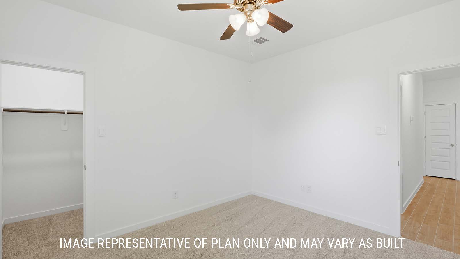 Waverley secondary bedroom with carpeted flooring and closet with view of hallway.