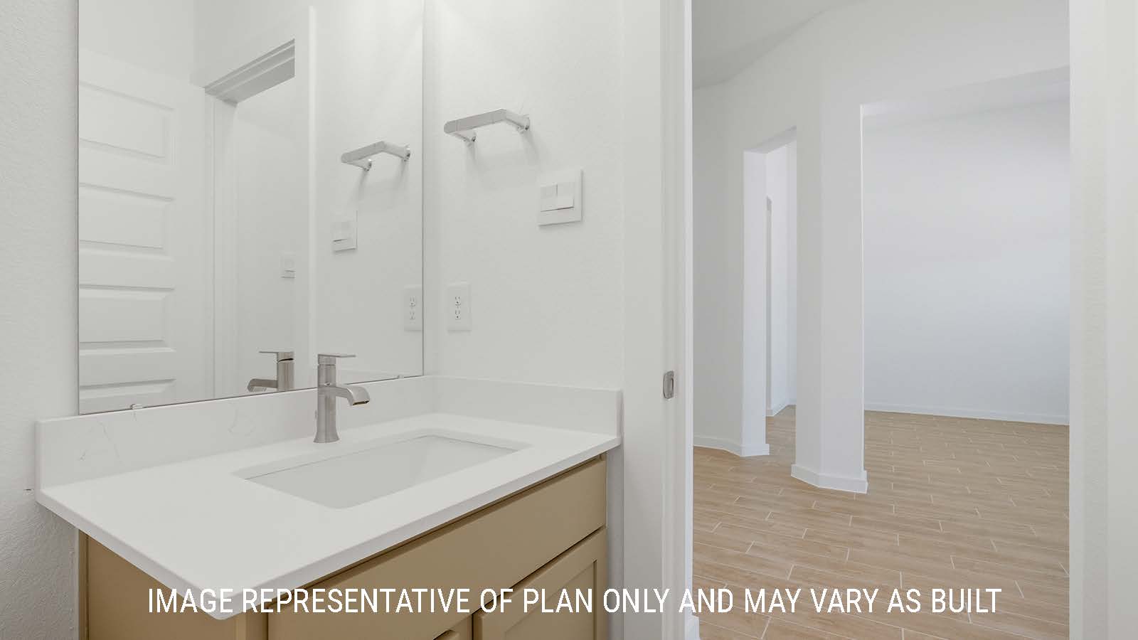 Waverley secondary bathroom with single vanity sink with dark cabinets and view of dining room.
