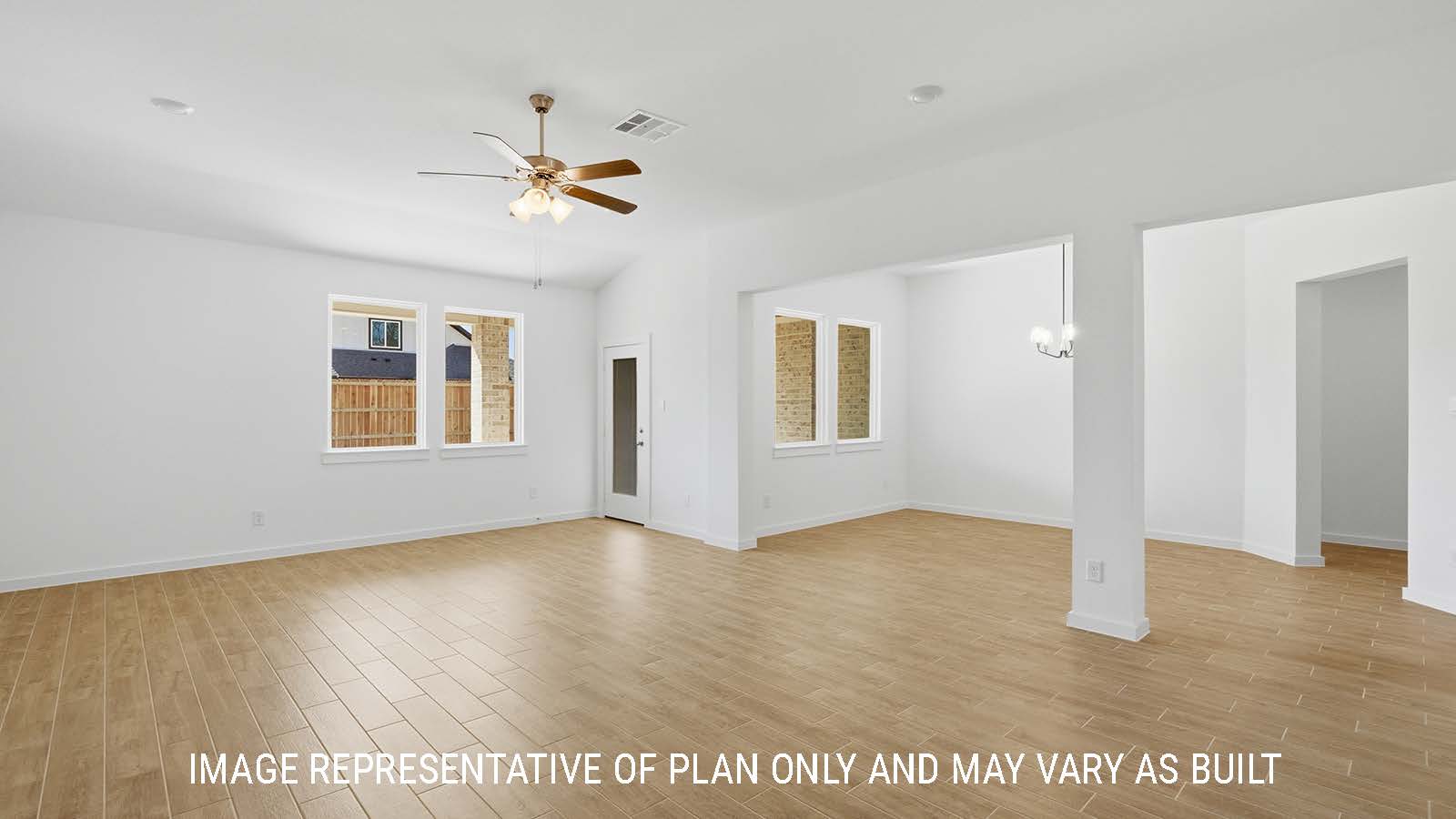 Waverley living room with windows for natural lighting and view of backyard.