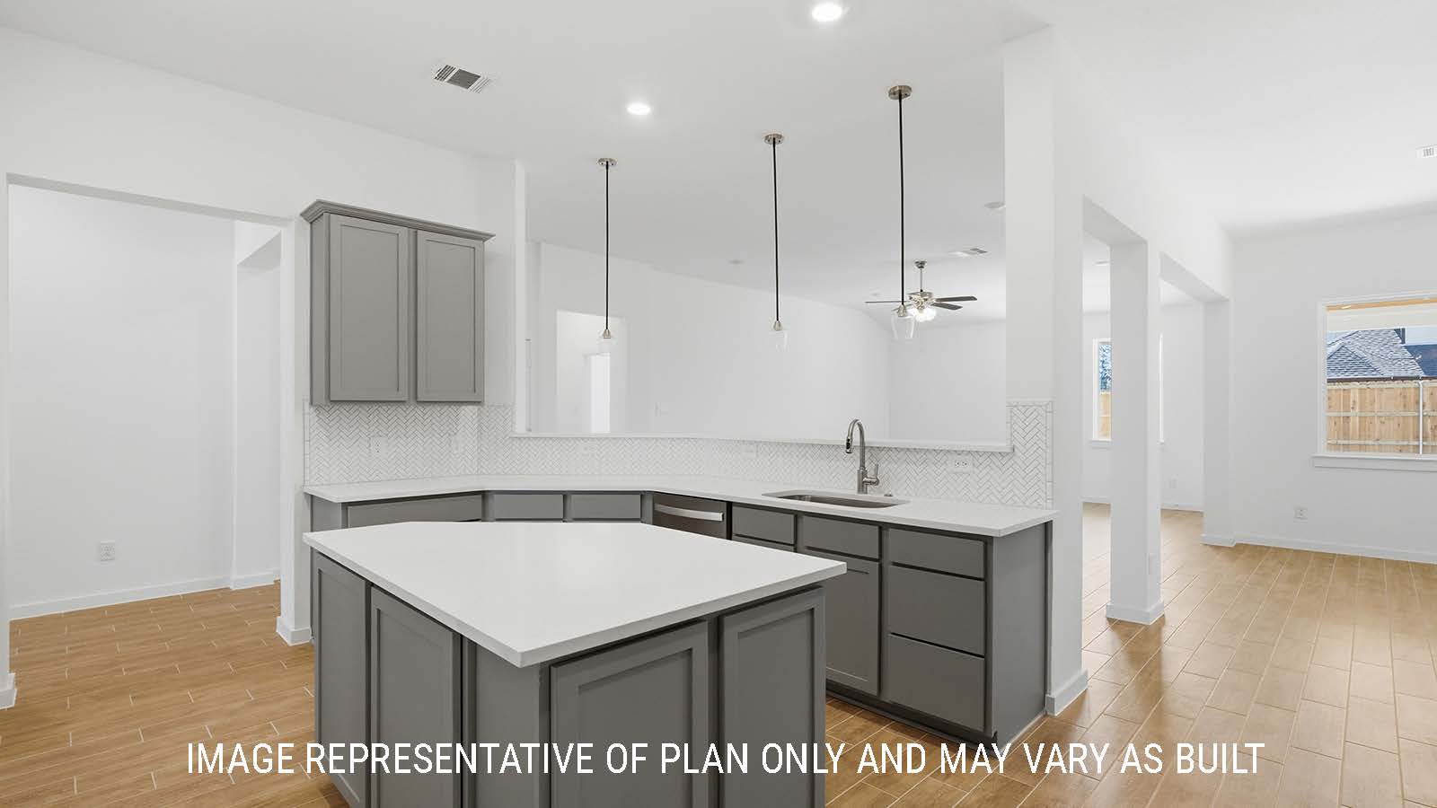 Waverley kitchen with kitchen island with grey cabinets and white countertops and view of living room.