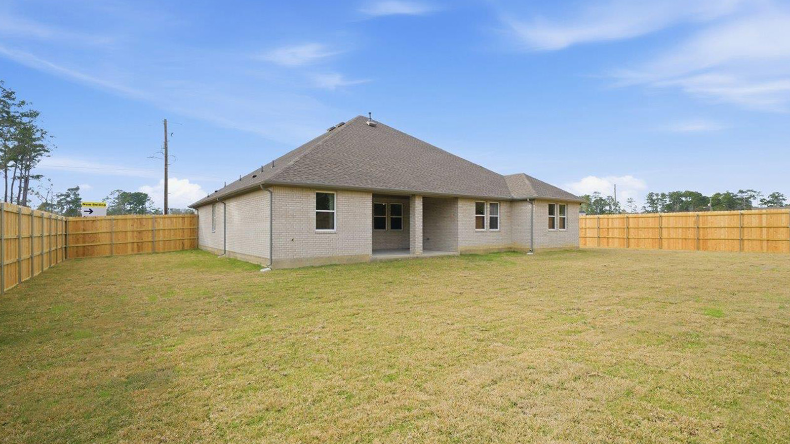 The woods model home berkshire back exterior with view of backyard.
