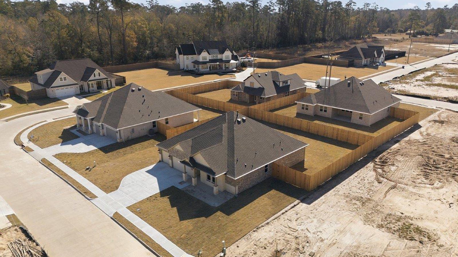 The woods model home ariel view of community.