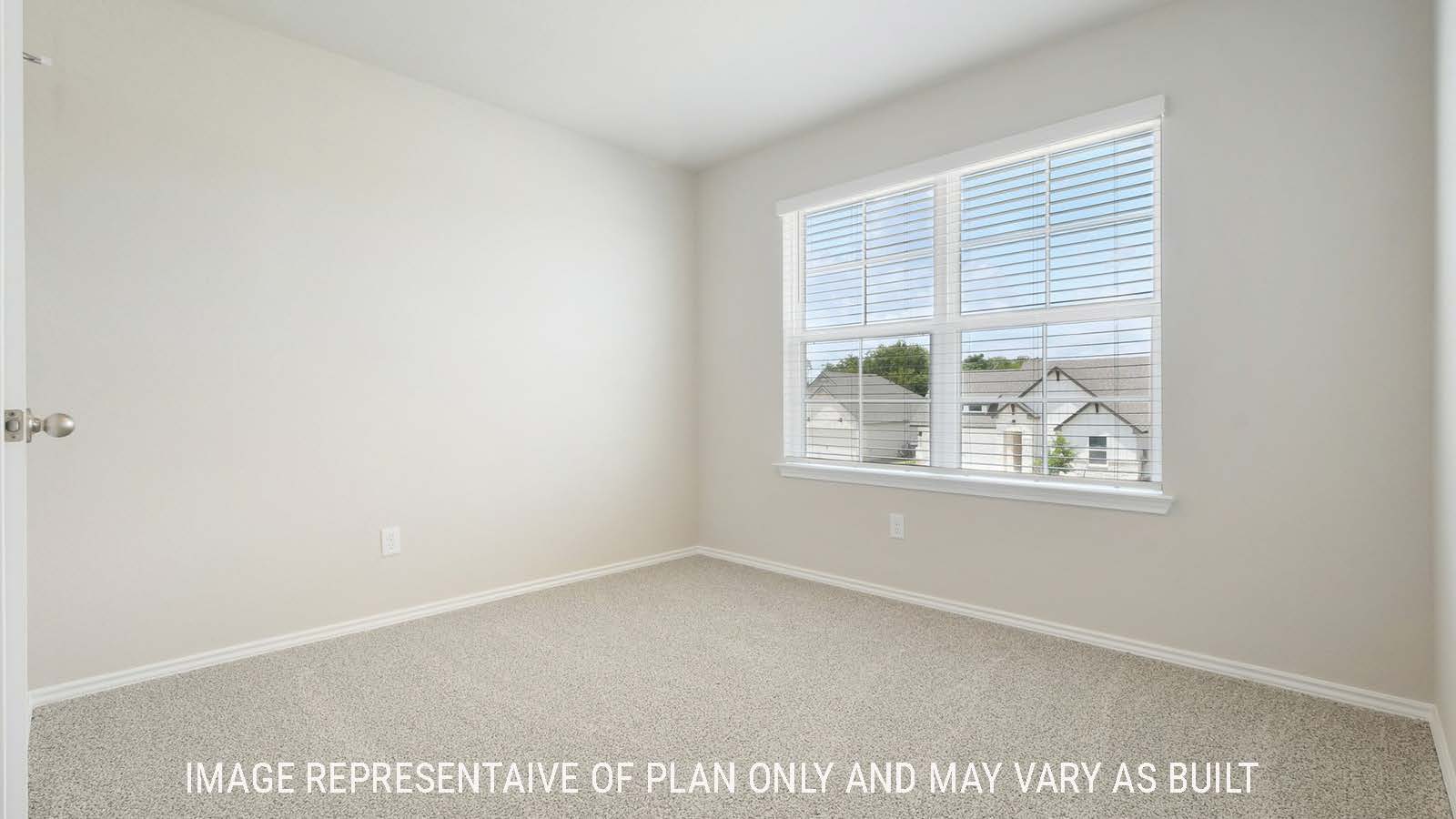 Prosper secondary bedroom with carpeted flooring and windows for natural lighting.