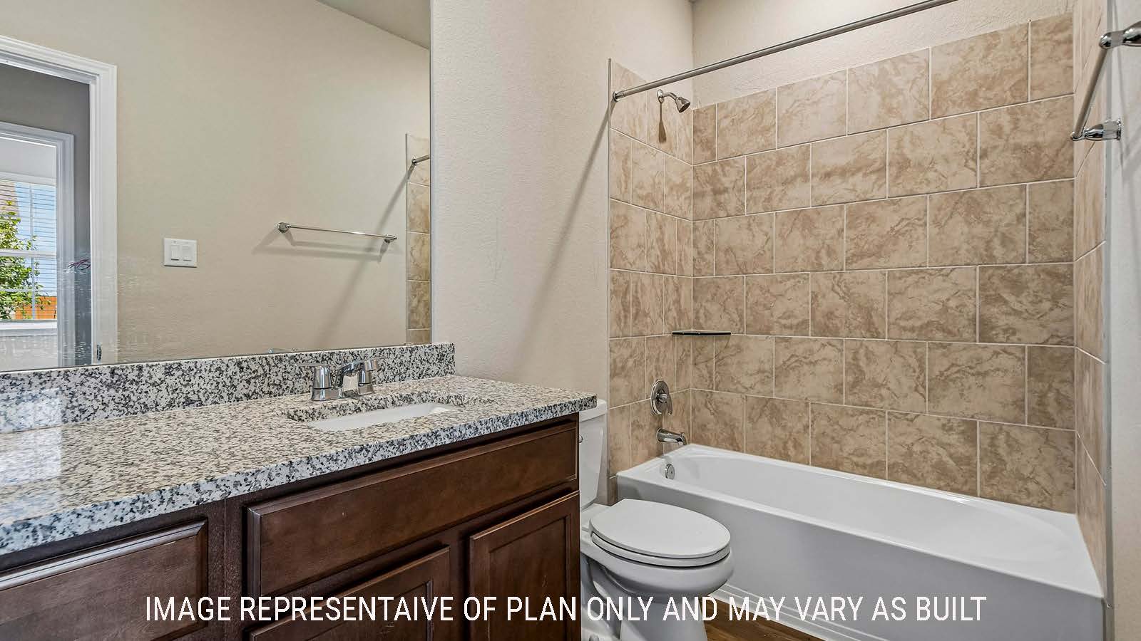 Prosper secondary bathroom with vanity sink and shower and tub combo.