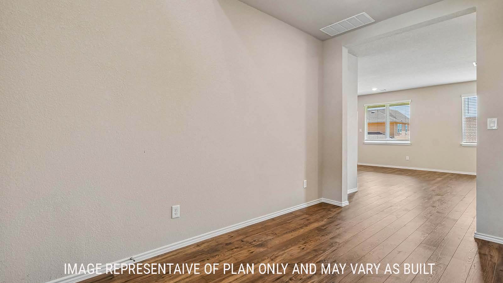 Prosper hallway with view of open concept dining room and living room.