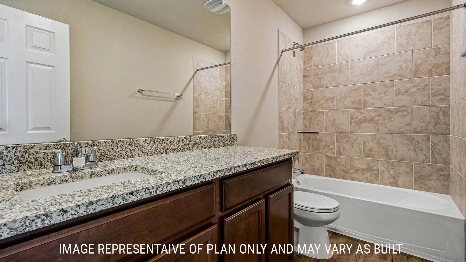 Prosper secondary bathroom with vanity sink and shower and tub combo.