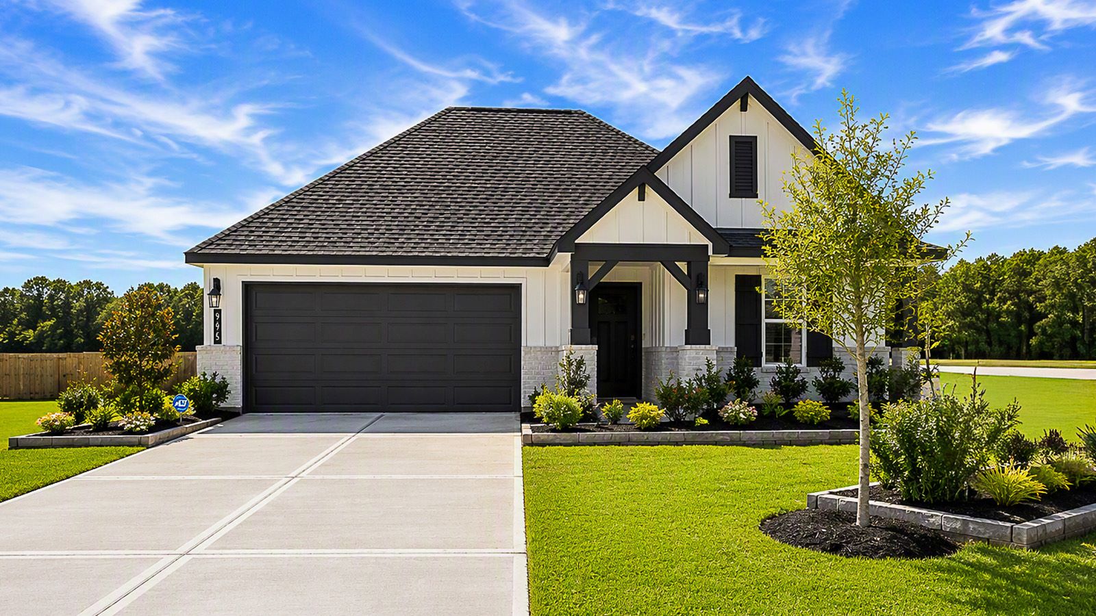 Highland Village model home front exterior with landscape.