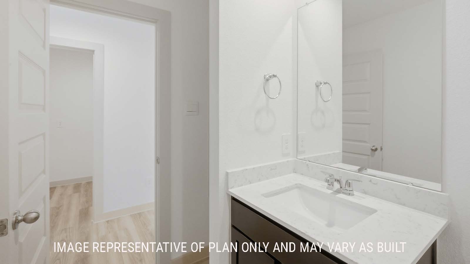 Elgin secondary bathroom with shelving for storage and vanity sink.