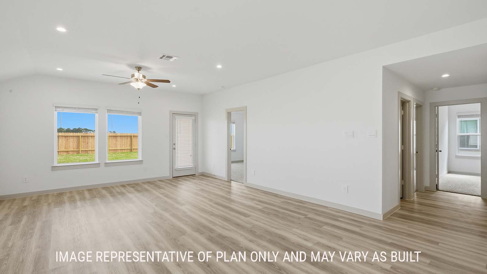 Elgin dining room with vinyl plank flooring and view of open concept living room.