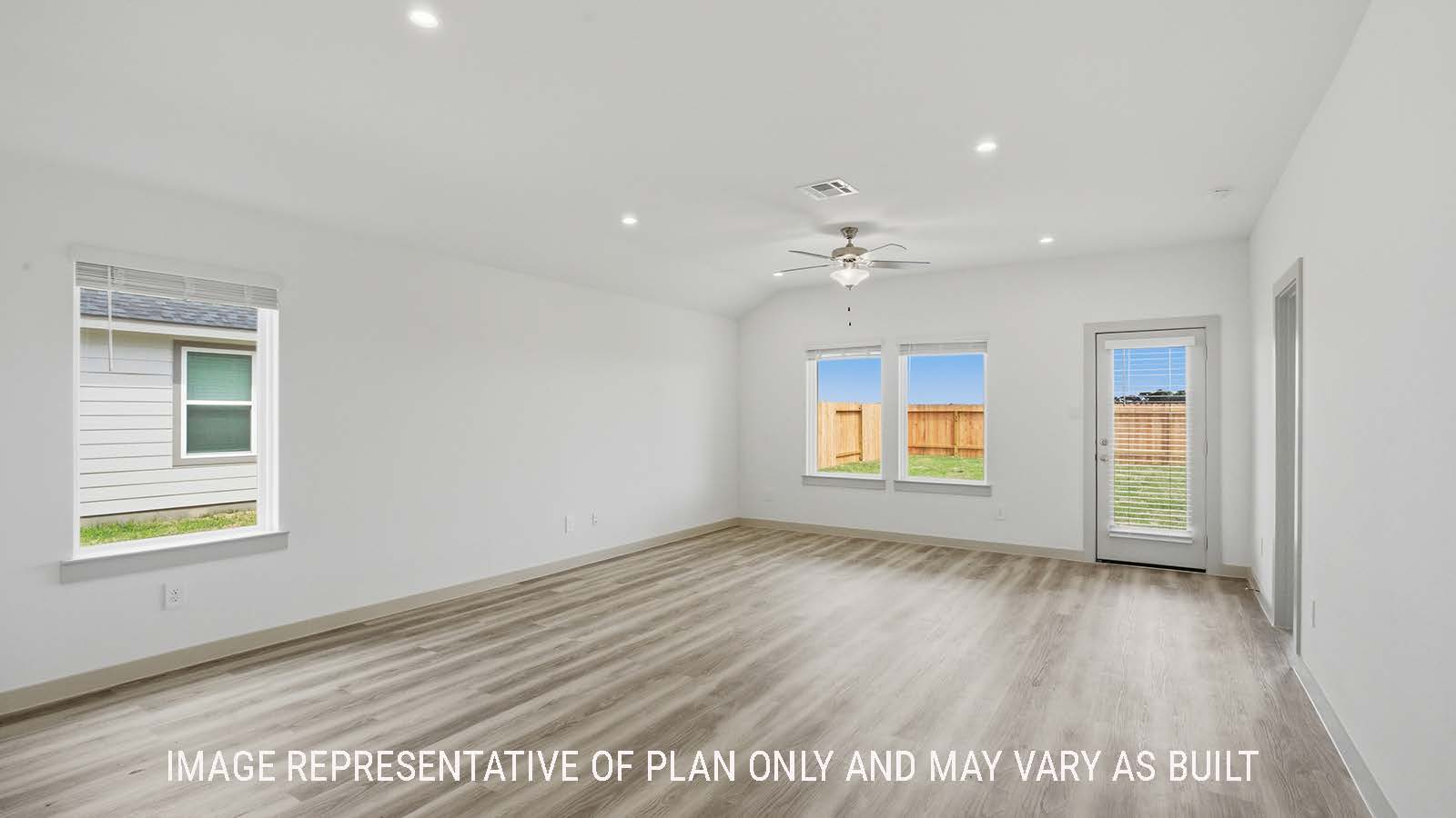 Elgin dining room with vinyl plank flooring and view of open concept living room.