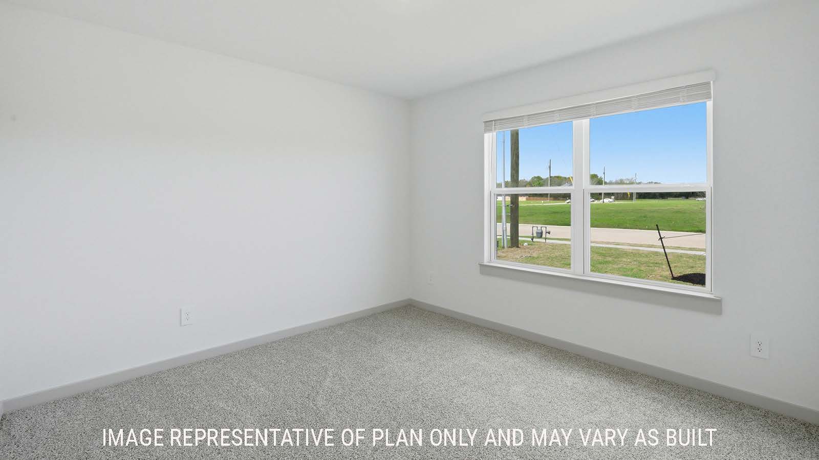 Texas Cali secondary bedroom with carpeted flooring and window for natural lighting.