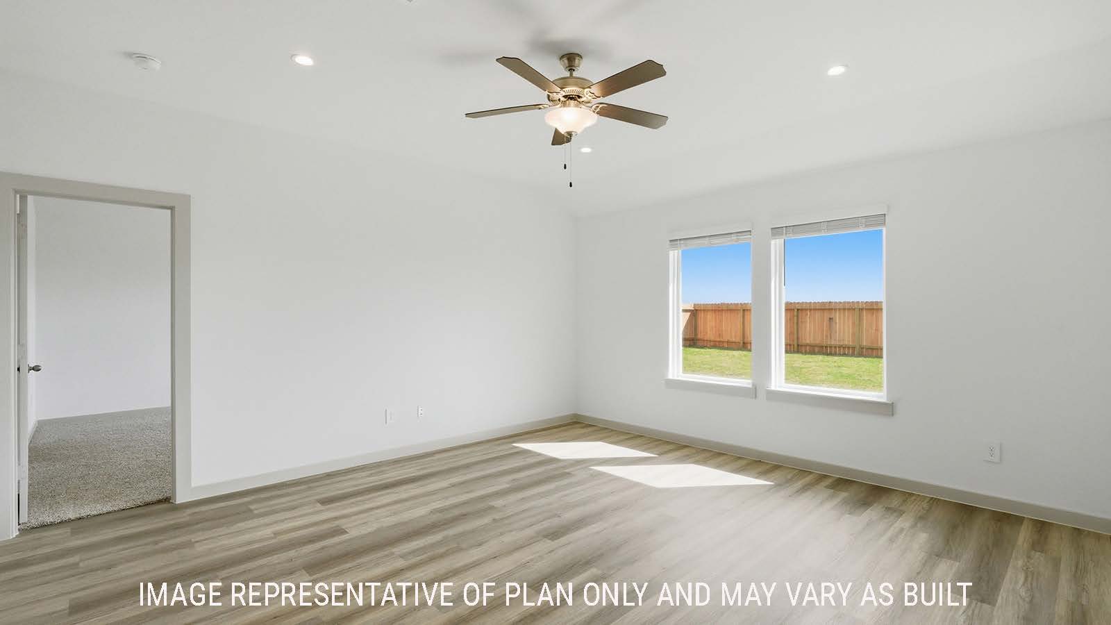 Texas Cali living room with vinyl plank flooring and windows with view of primary bedroom.