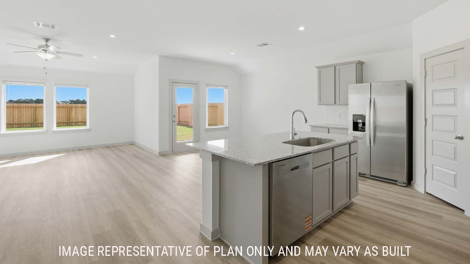 Texas Cali kitchen with kitchen island with granite countertops and view of open concept dining room and living room.