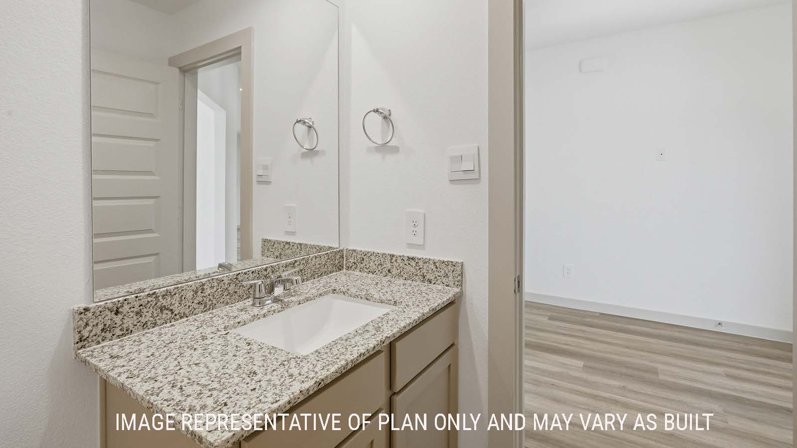 Lakeway secondary bathroom with vanity sink and view of front entry hallway.