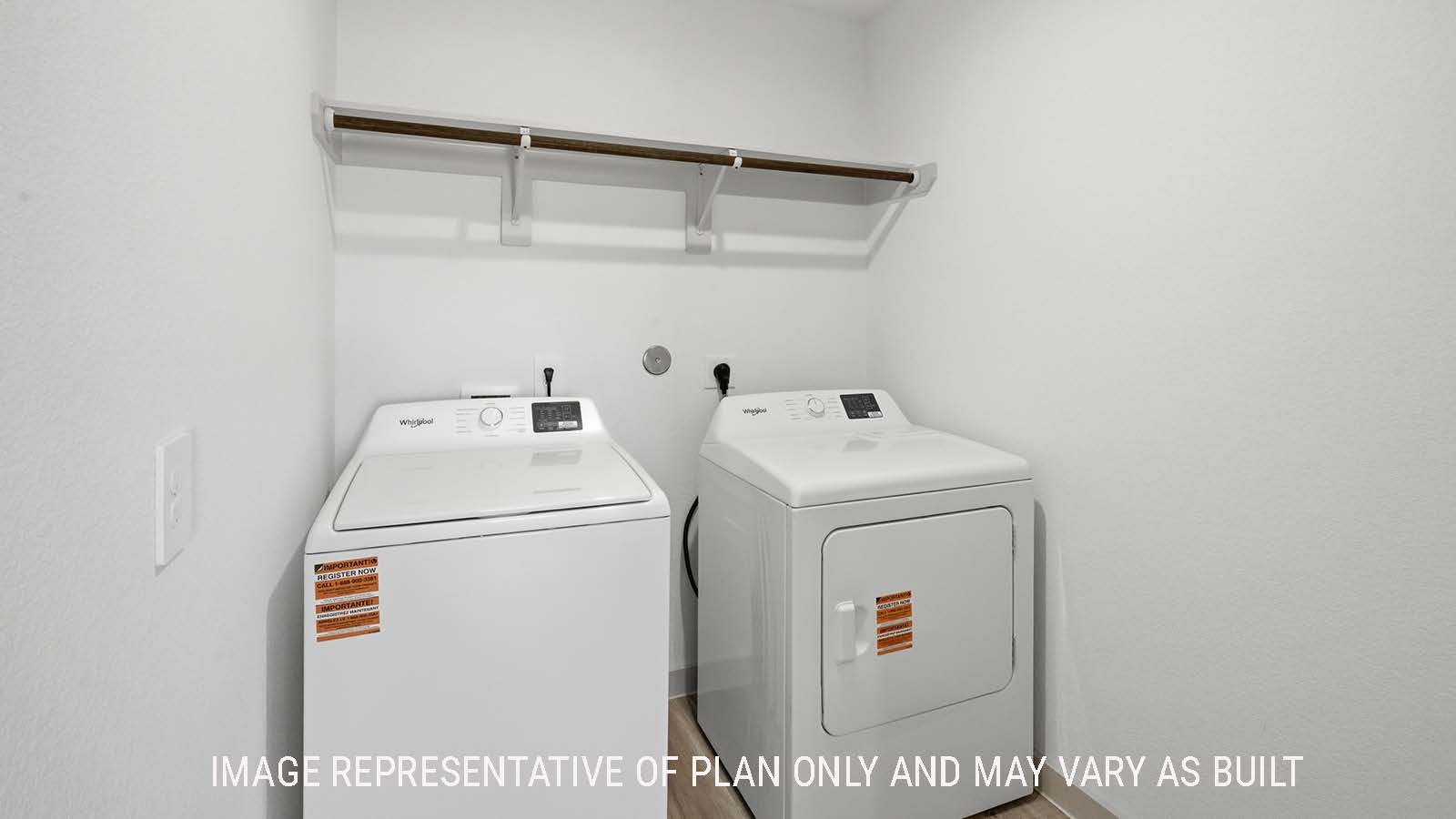 Lakeway utility room with washer and dryer and shelving for storage.