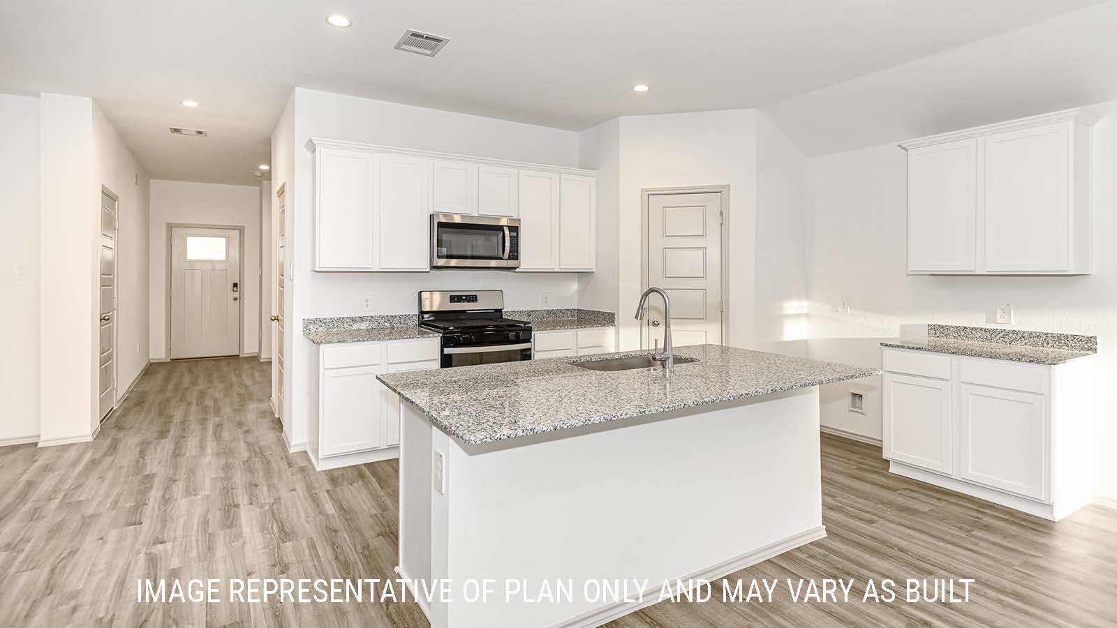 Lakeway kitchen with kitchen island and white cabinets with granite countertops.