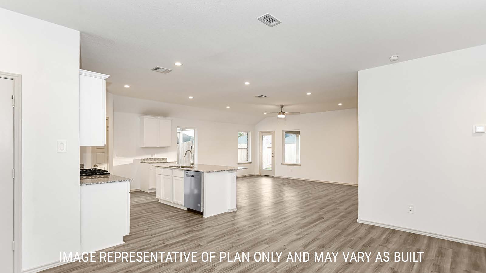 Lakeway dining room with vinyl plank flooring and view of kitchen.
