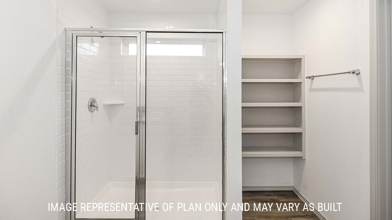 Lakeway primary bathroom with walk-in shower and shelving for storage.