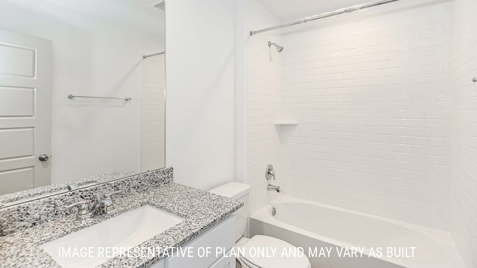 Lakeway secondary bathroom with vanity sink and shower and tub combo.
