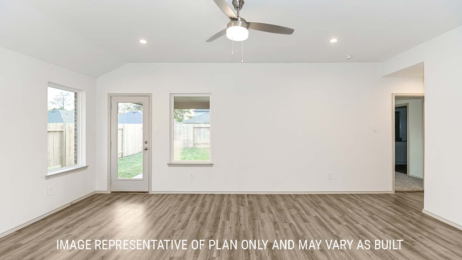 Lakeway living room with vinyl plank flooring with view of back door to backyard.