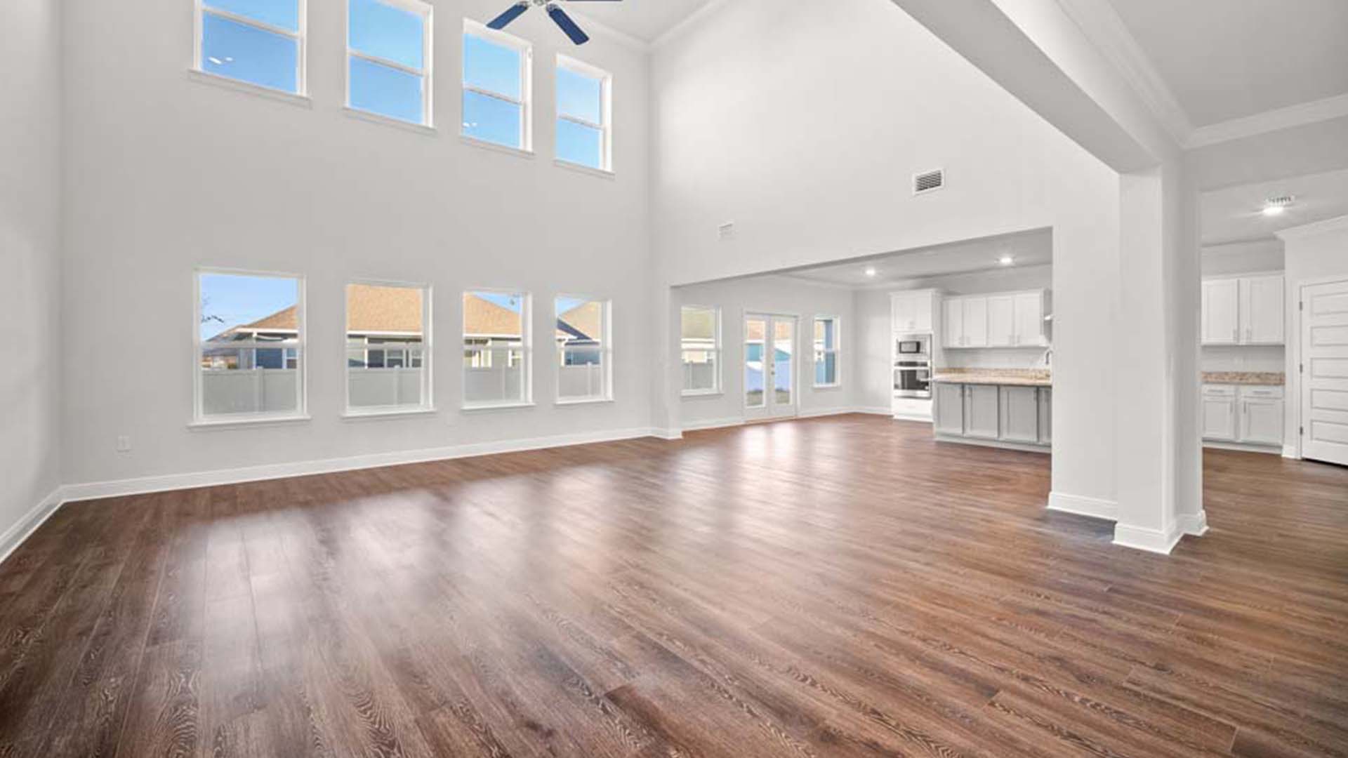 This home has exceptionally high ceilings and multiple windows spanning the back of the home.