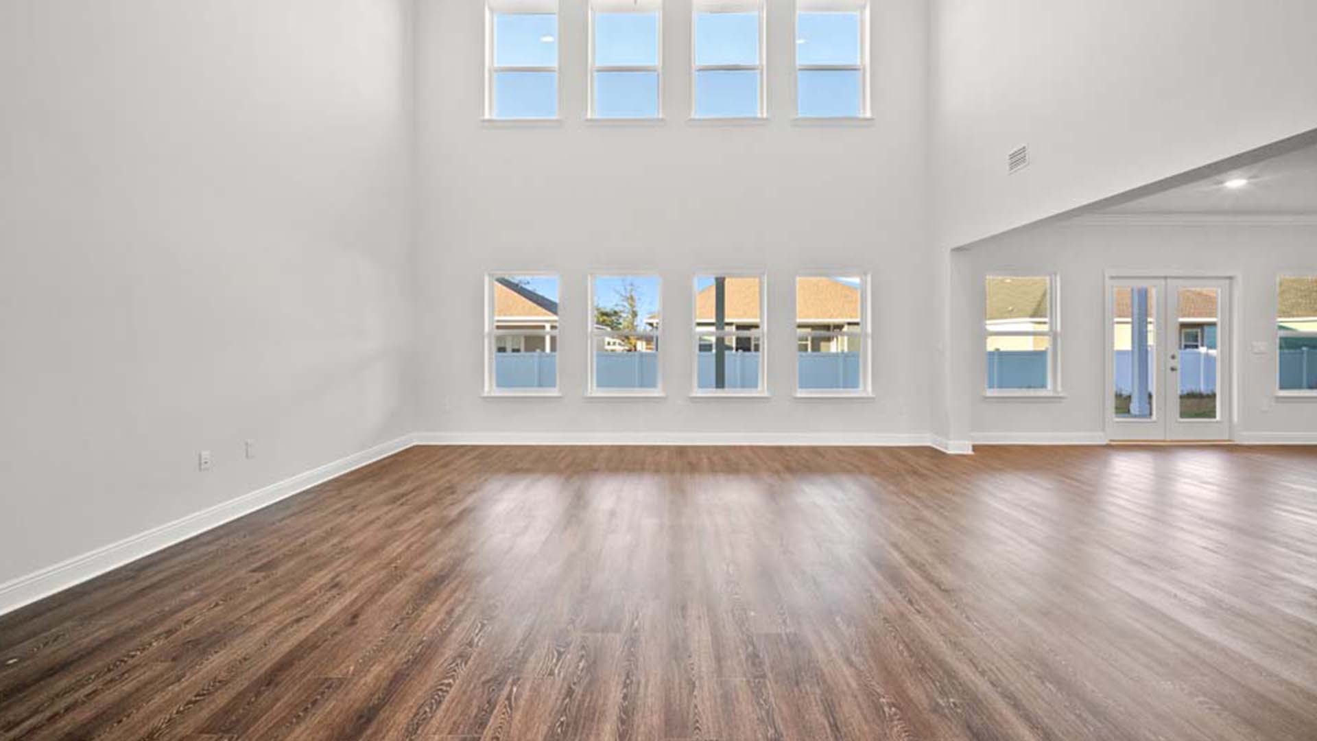 Expansive windows create a bright and airy feel