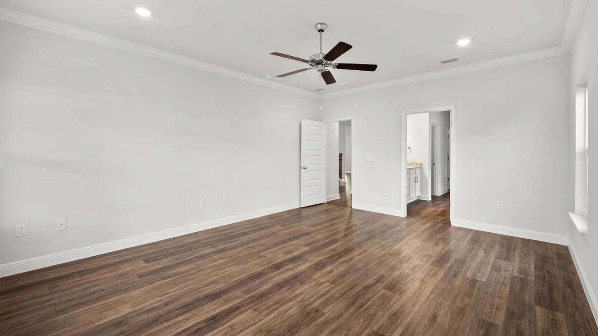 The primary bedroom is on the main level and has EVP flooring