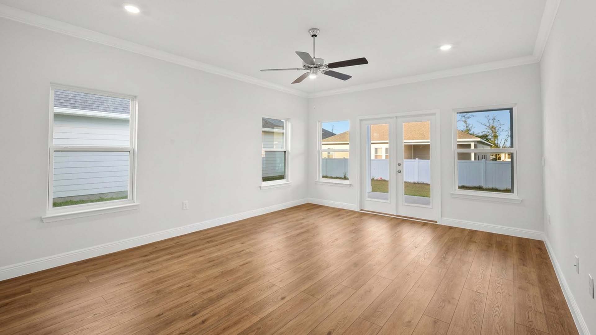The primary bedroom has access to the back patio