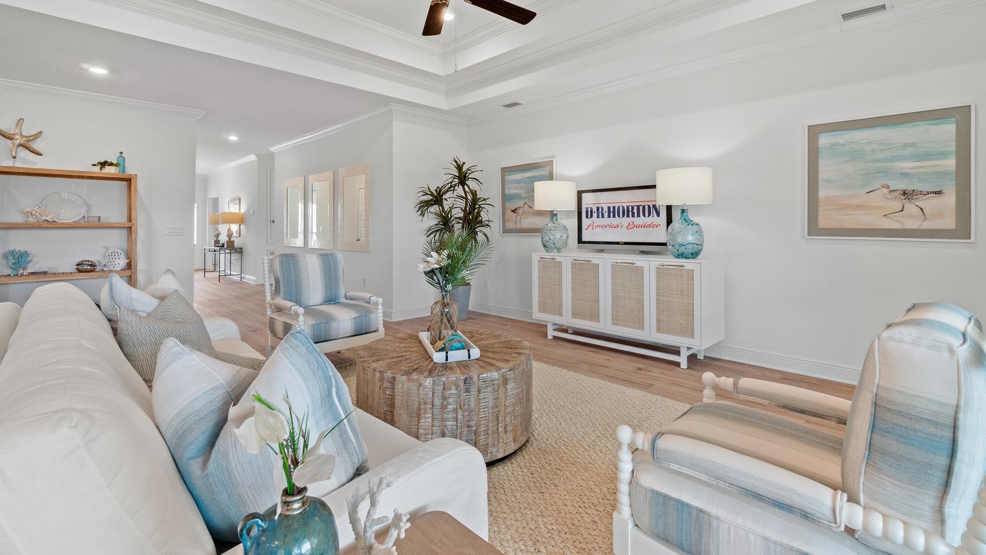 The family room features traditional 9 foot ceilings with ceiling fan
