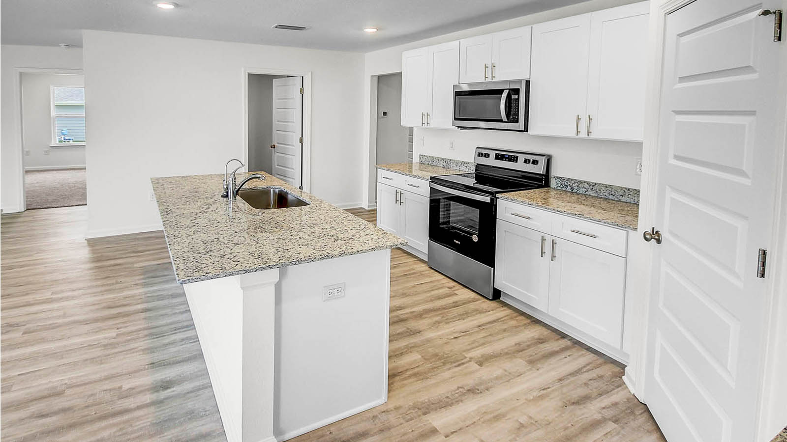 The kitchen allows for easy prep and clean up with the large center island