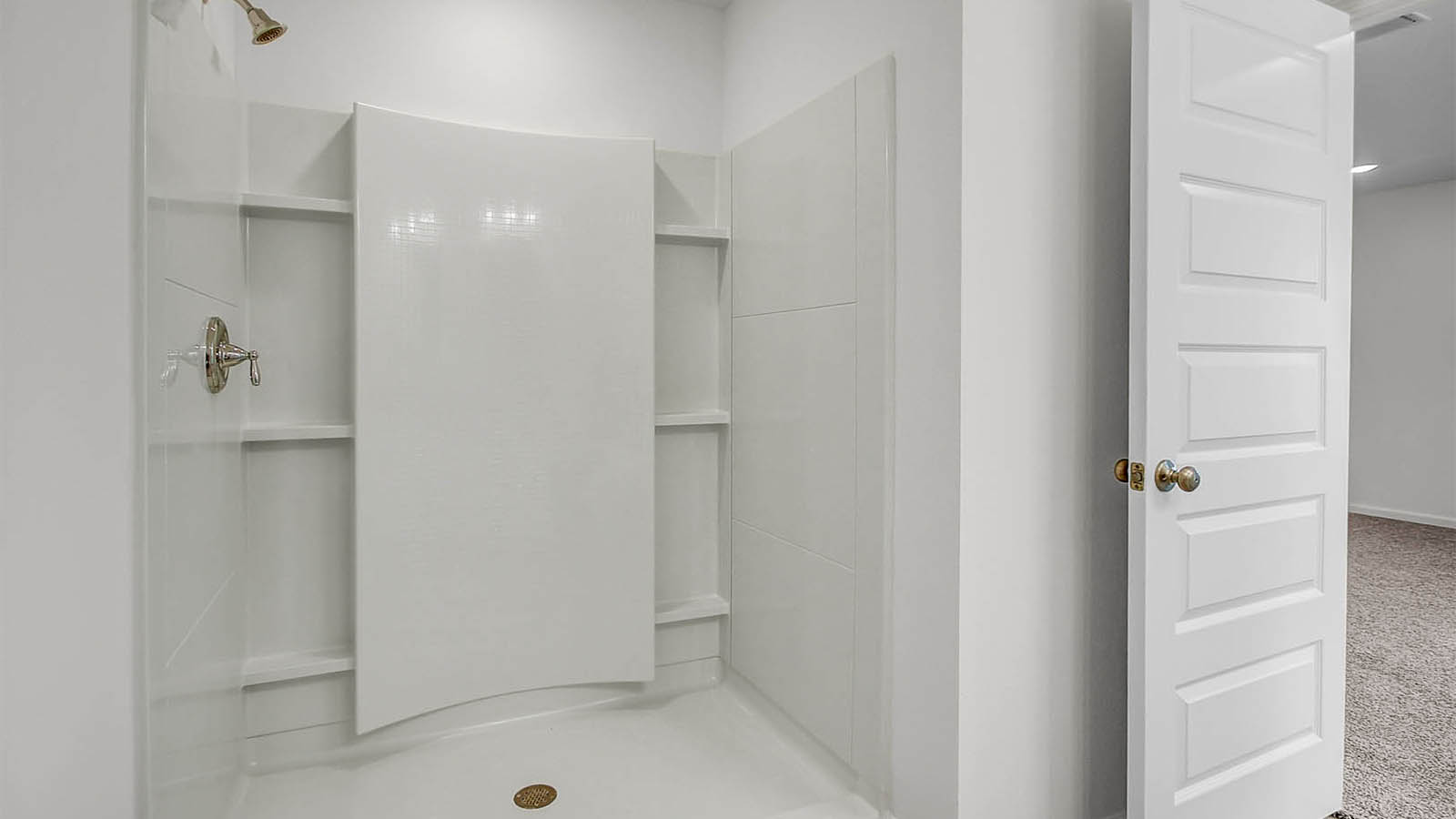 The primary bathroom features an oversize shower as well as a large walk-in closet