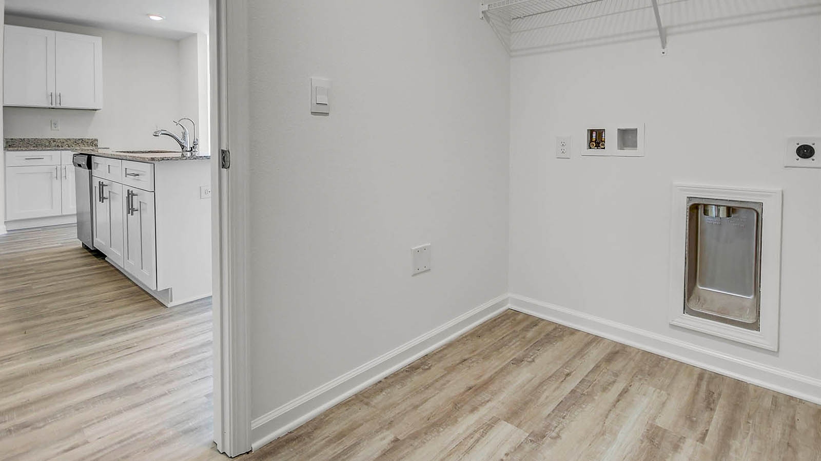 The large laundry room is just off the entry to the kitchen and can fit a full size washer and dryer