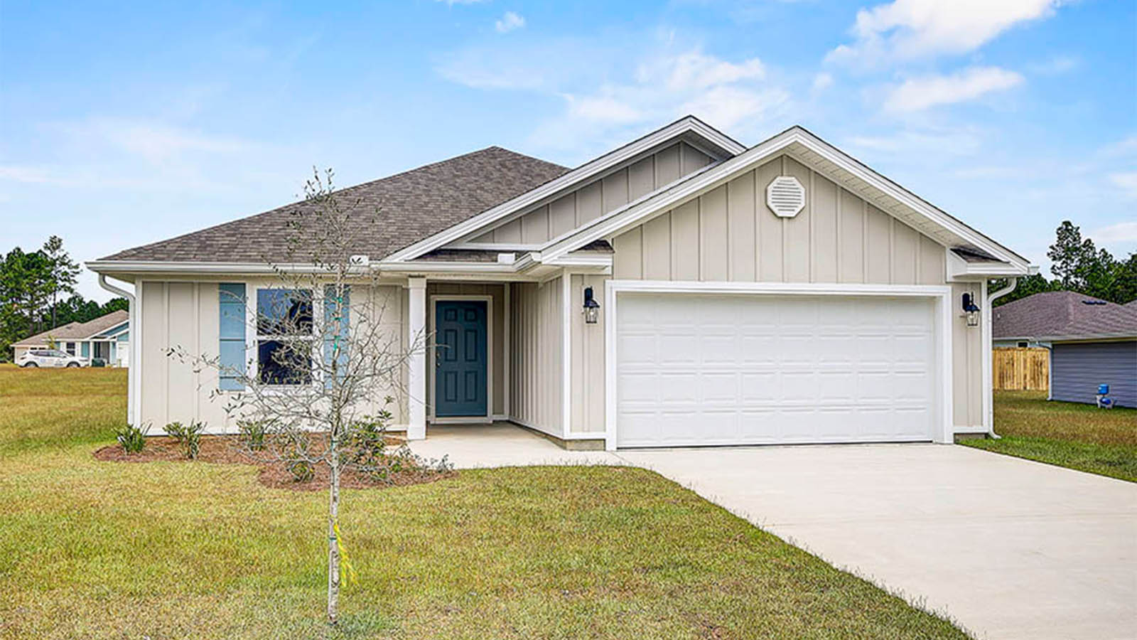 Exterior photo of home front entry with two car garage