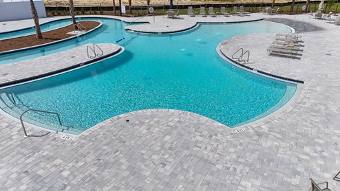 Pool with a patio for outdoor lounging