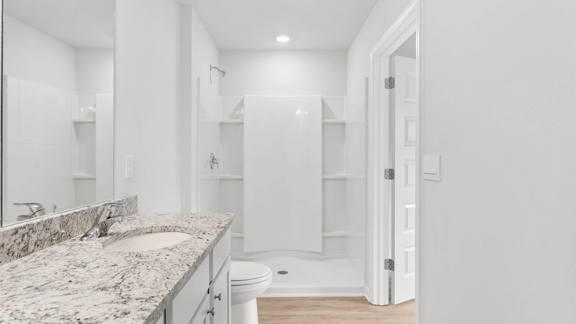 The primary bathroom has a large shower