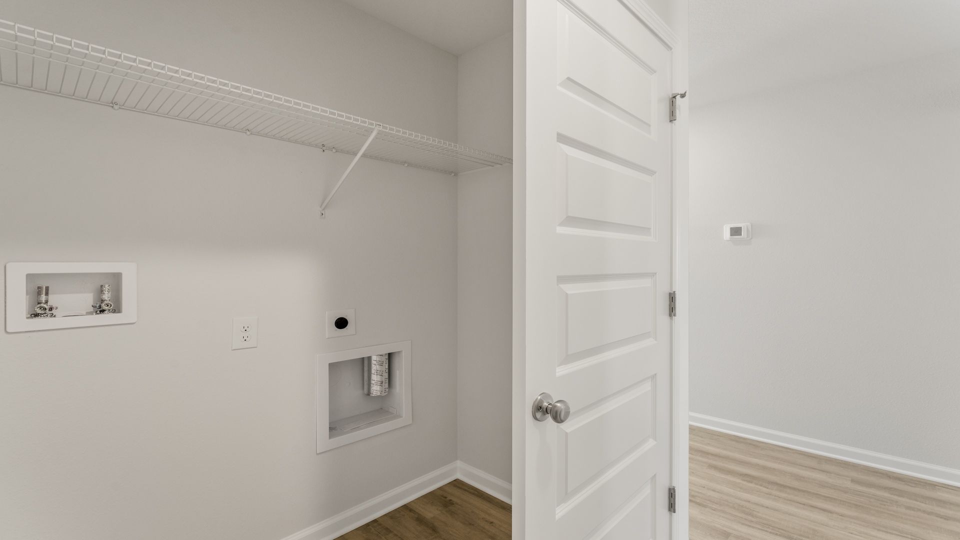 The laundry room will accommodate a full size washer and dryer